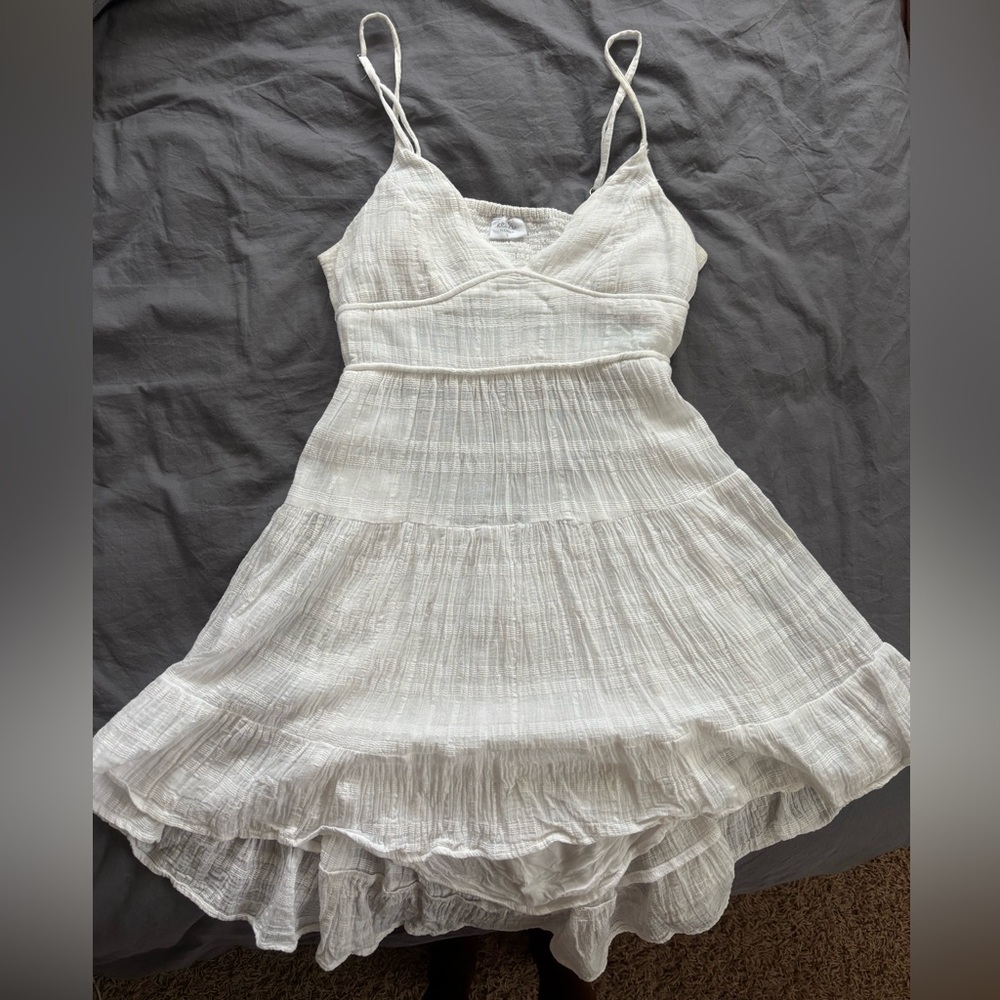 Keliki white linen mini dress, with open back detail